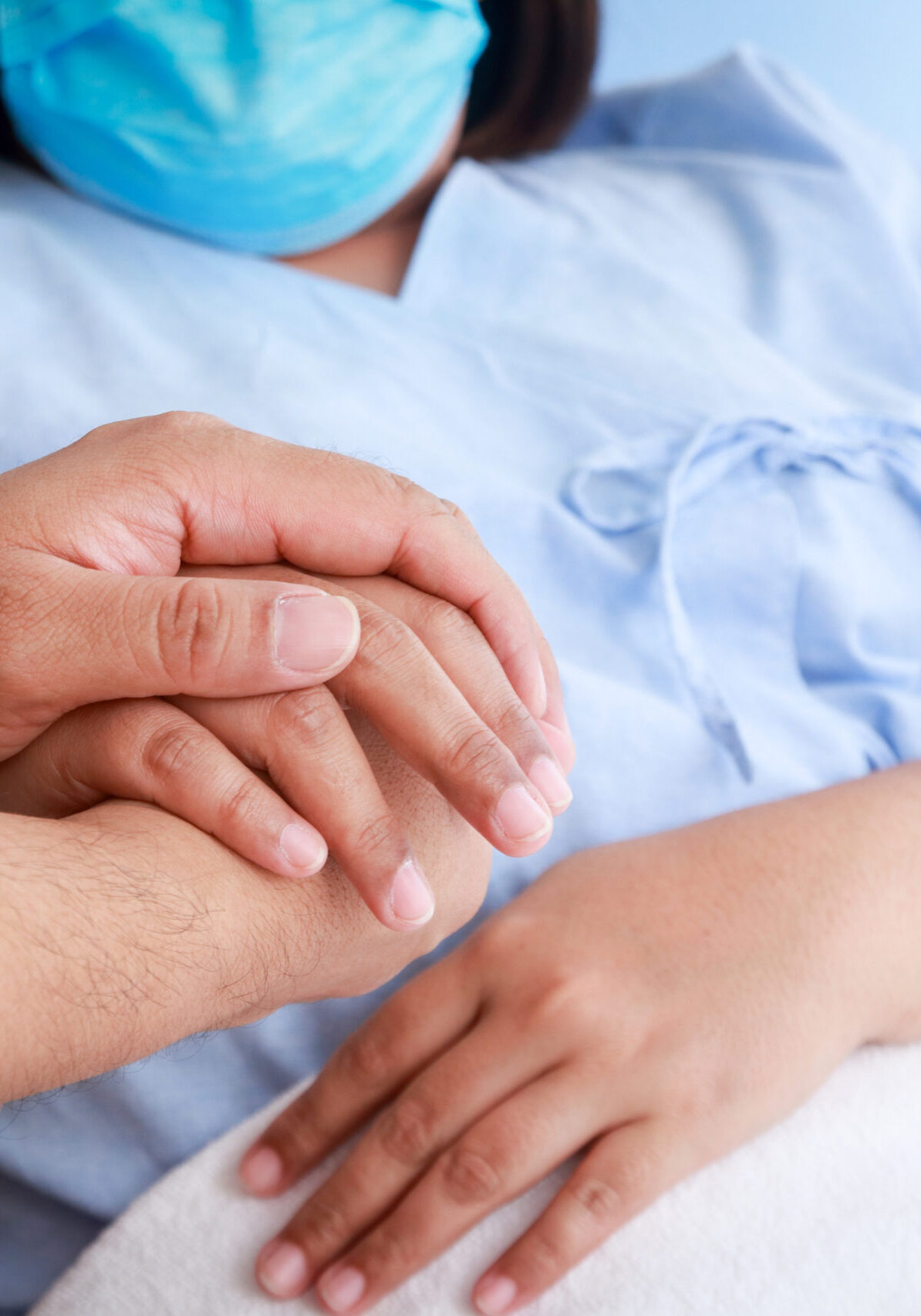 family holding hands Give encouragement to the patient lying in the hospital bed. Medical services. Obesity disease